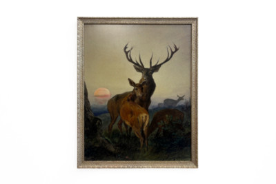 Um veado com um veado numa paisagem arborizada ao pôr-do-sol - Carl Friedrich Deiker