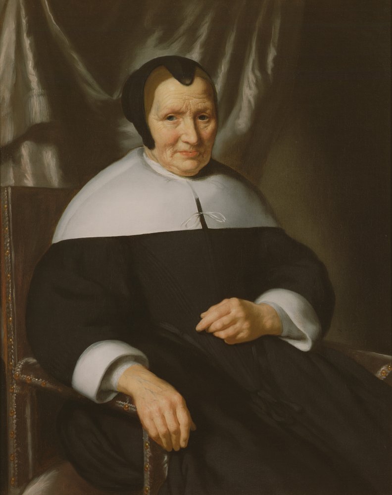 Retrato de uma senhora sentada em uma poltrona de Nicolaes Maes