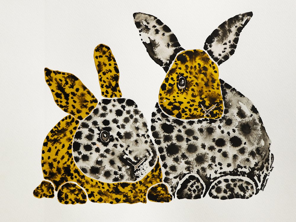 Coelhos amarelos malhados de Santhosh ch