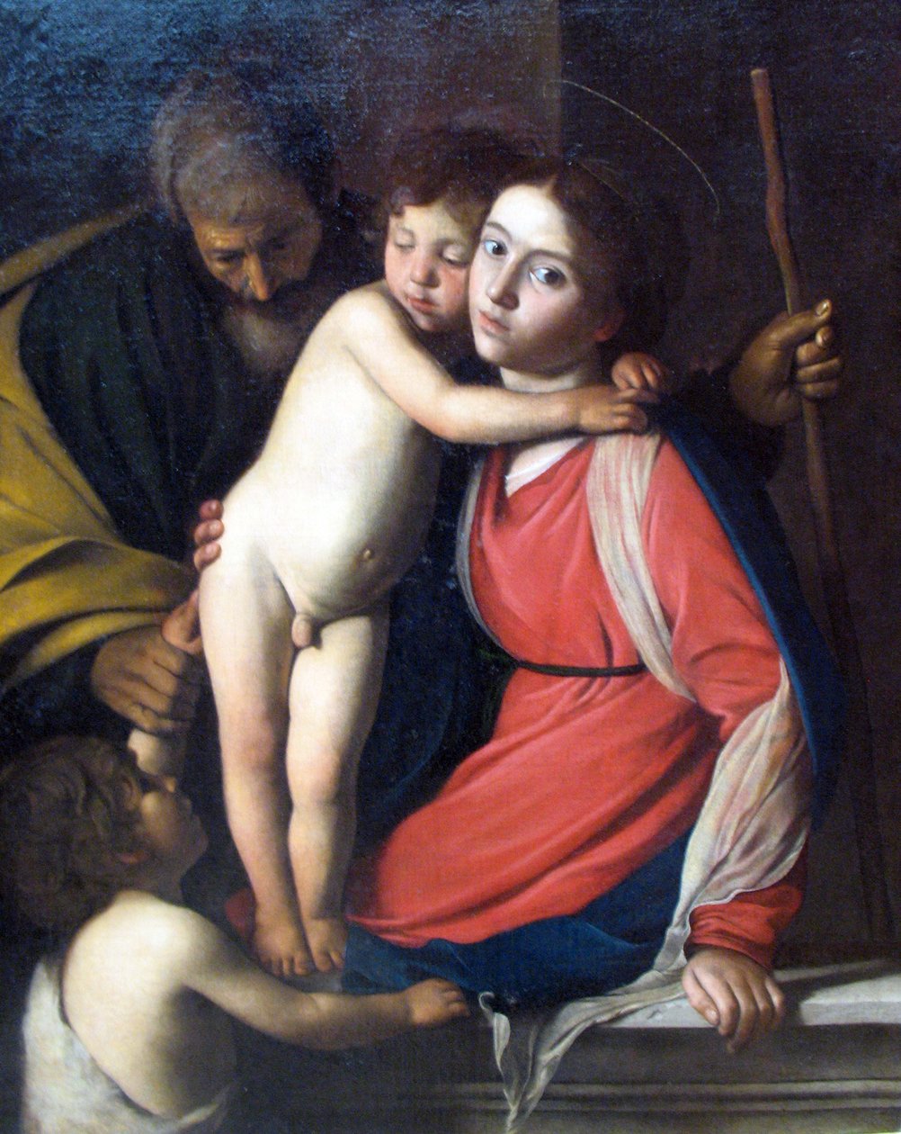 A Sagrada Família com o Menino São João Batista de Michelangelo Merisi Caravaggio