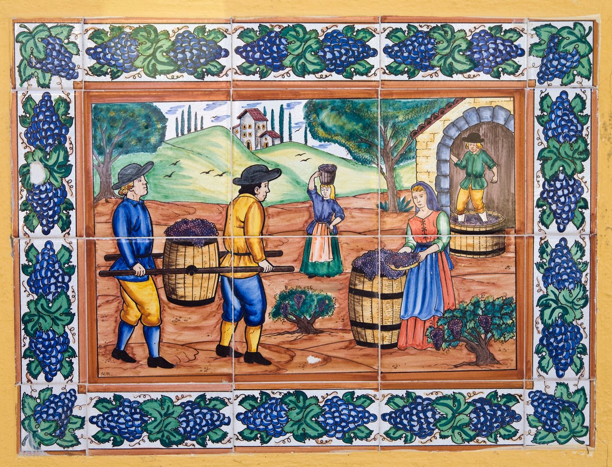 Azulejos espanhóis modernos em estilo do século XVII ou XVIII, mostrando trabalhadores carregando uvas de volta à adega de vinhedos de Unknown