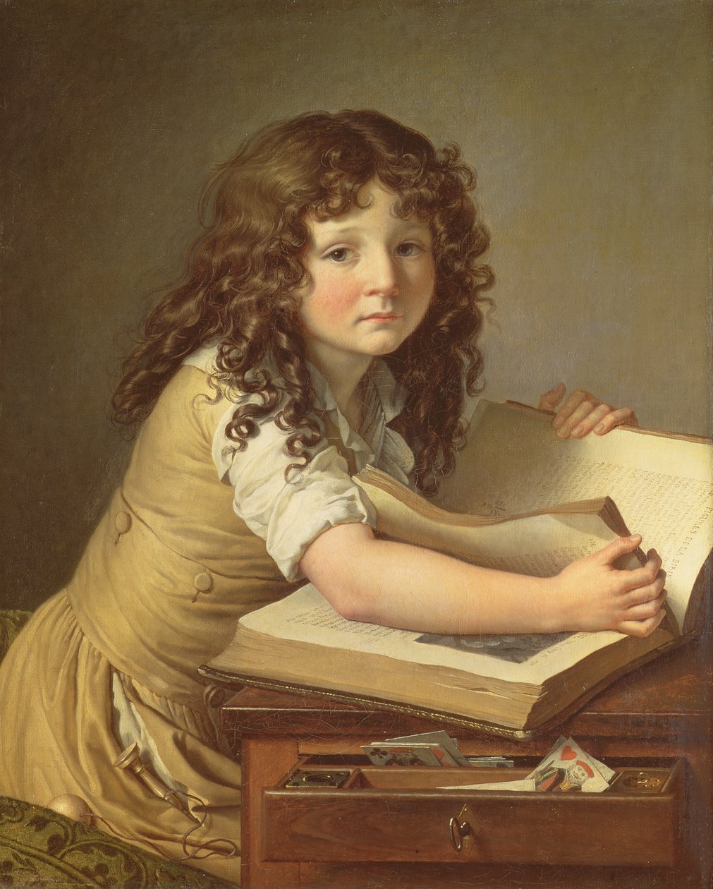 Uma criança olhando fotos em um livro de Anne Louis Girodet de Roucy Trioson