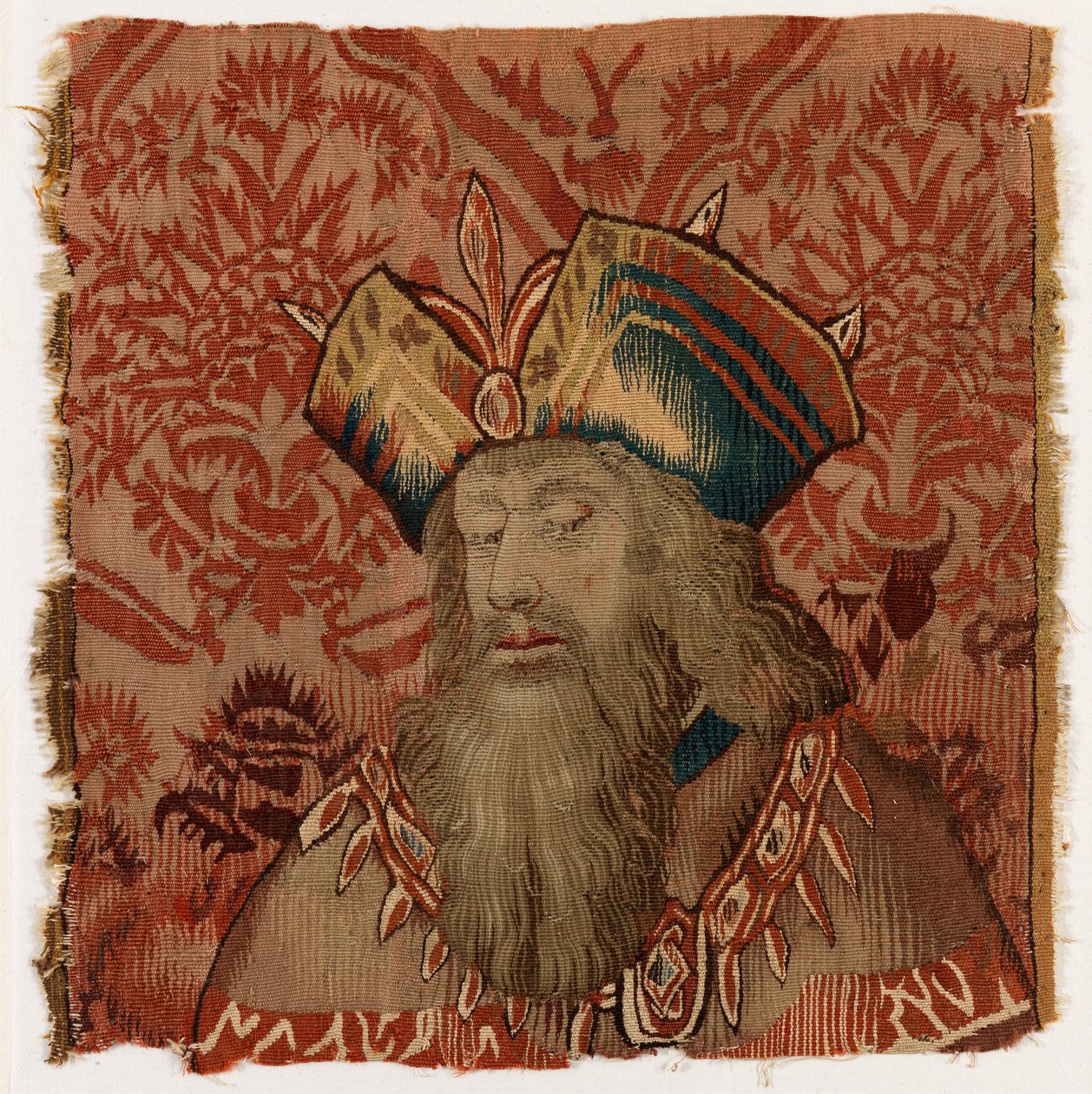 Painel de tapeçaria representando a cabeça de um padre ou de um rei, fabricado possivelmente em Tournai, Bélgica, possivelmente no início do século XVI (lã) de Belgian School