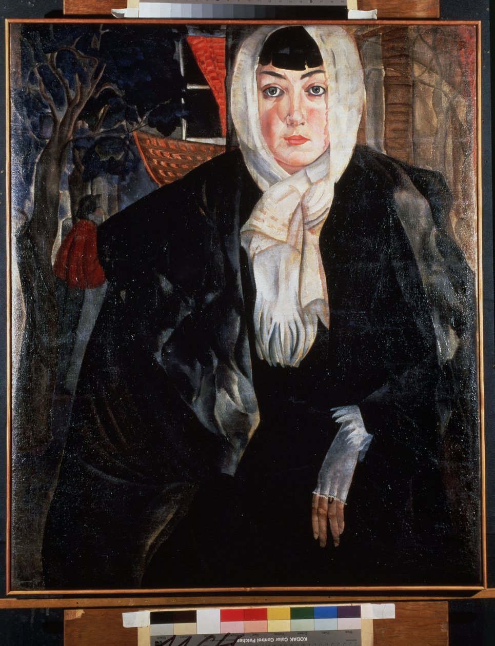 Retrato de uma mulher (Retrato Feminino). Bela mulher de rosto melancólico, na rua, com a cabeça coberta com o seu lenço, vestindo um grande casaco preto, inclinada despreocupadamente, revelando uma mão delicada com uma luva branca. Trabalho por Bo de Boris Dmitrievich Grigoriev