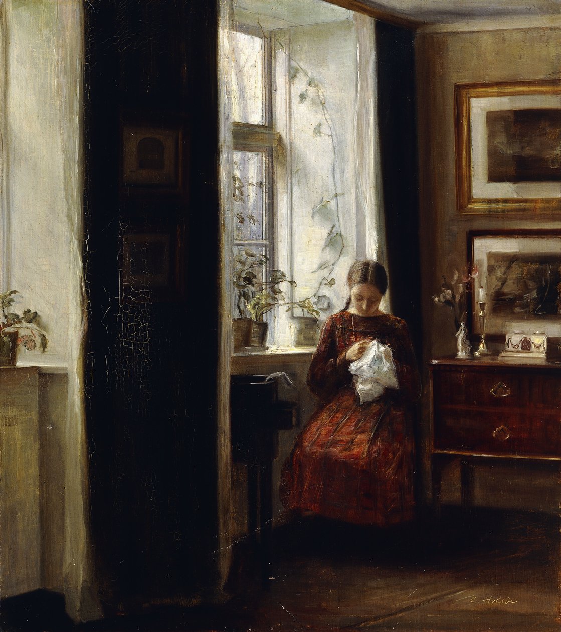 Uma jovem costurando de Carl Holsoe