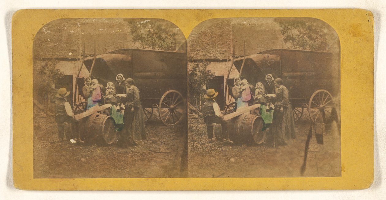 [Grupo familiar em frente a uma carroça, pai e filho em cima de uma serra improvisada]. de Charles Peeters
