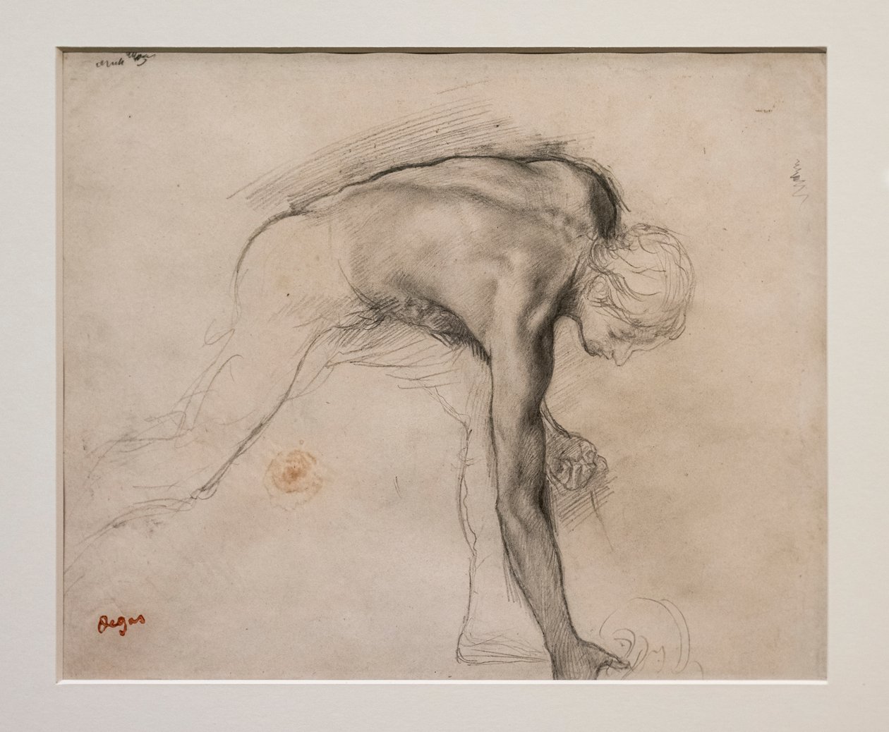 Homem nu inclinado a apanhar um objecto. Por volta de 1859-1861. Grafite em papel de velino. de Edgar Degas