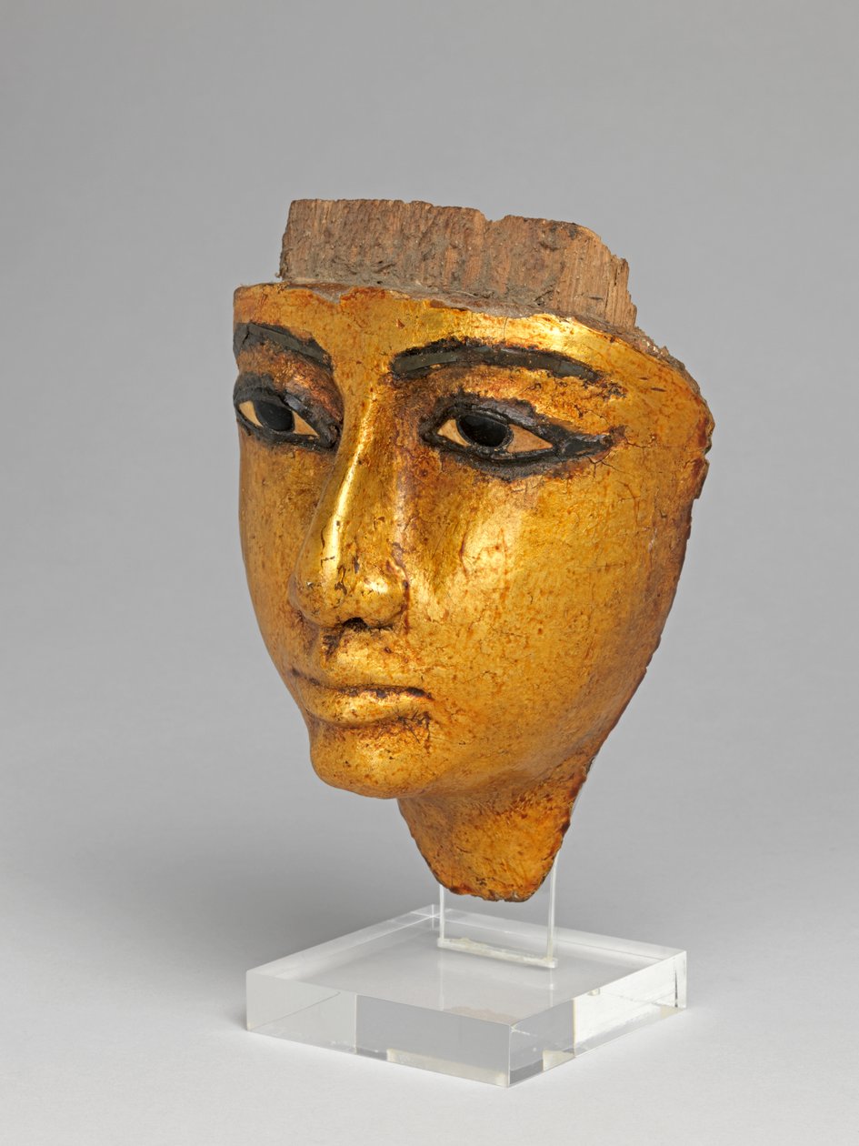 Rosto de um caixão, com olhos e sobrancelhas incrustados, dourados de Egyptian 20th Dynasty