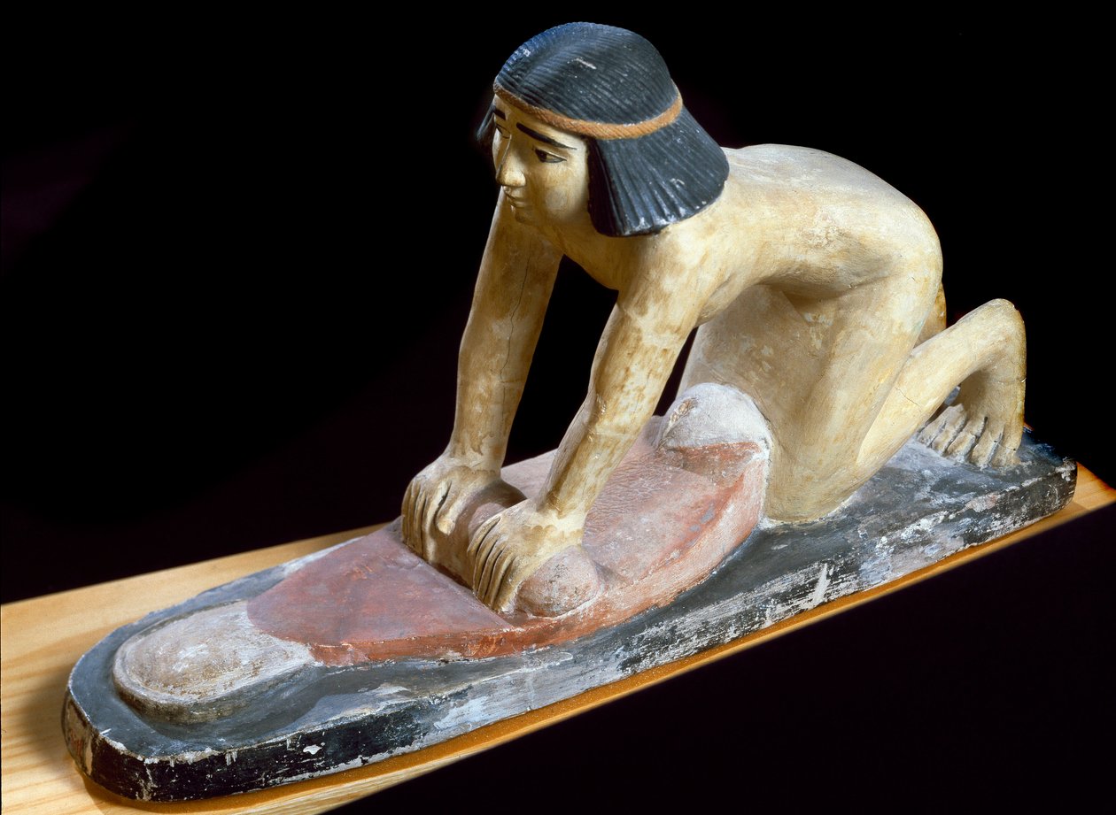 Antiquidade egípcia: "Cereais egípcios esmagados para fazer pão" Figurine. 5ª Dinastia. 2400 AC. Florença, Museo Archeologico. de Egyptian 5th Dynasty