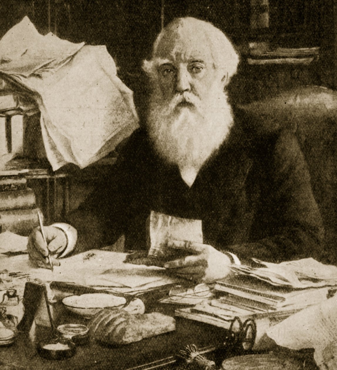 Austen Henry Layard sentado em sua mesa de English School
