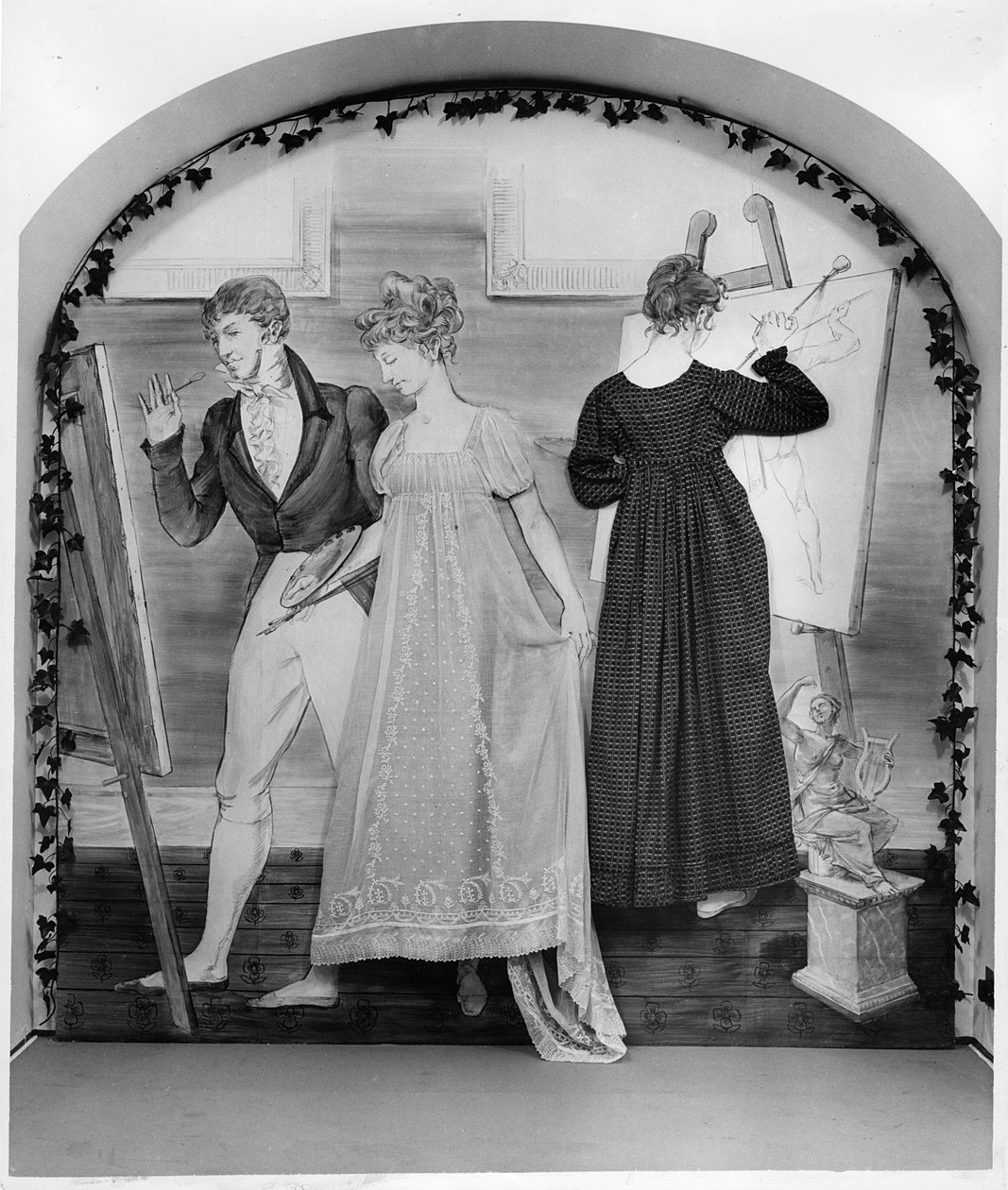 A lição de pintura, parte de uma exposição no Museu da Moda com dois vestidos de dia, início do século 19 (algodão) de English School