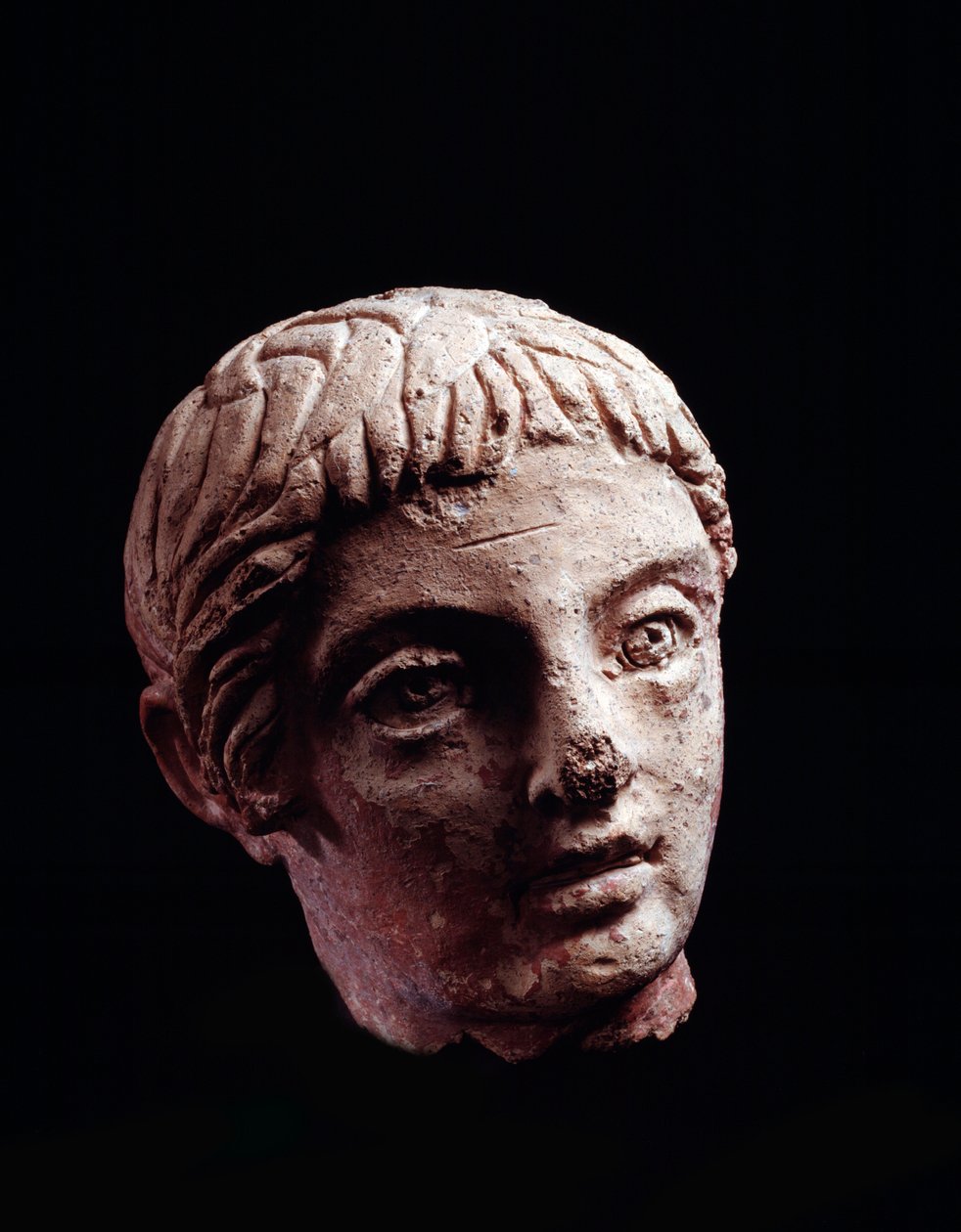 Civilização etrusca: cabeça de jovem do templo de Belvedere, em Orvieto - séc. V-IV aC Diâm 13 cm de Etruscan