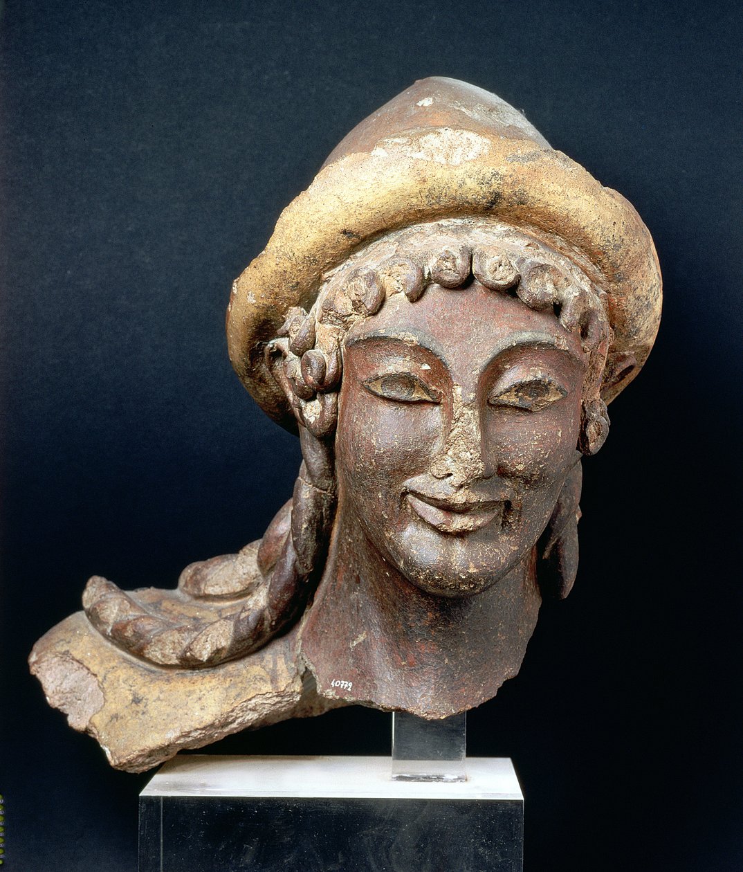 Cabeça de Hermes usando um pilos, do Templo de Portonaccio, Veii, 510-500 aC (terracota policromada) de Etruscan