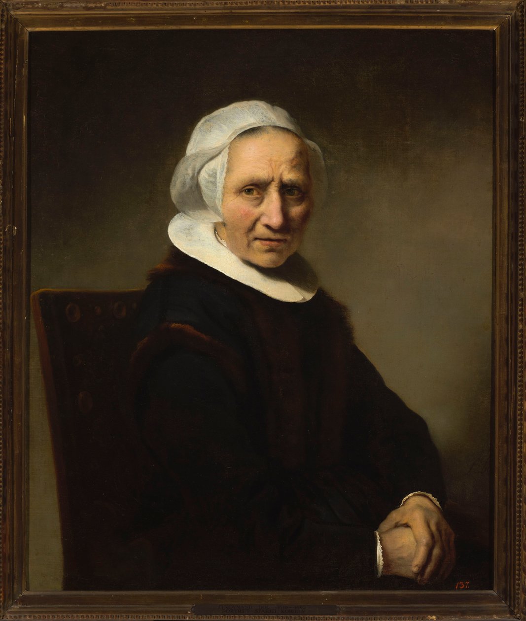 Retrato de uma mulher idosa com touca branca de Ferdinand Bol