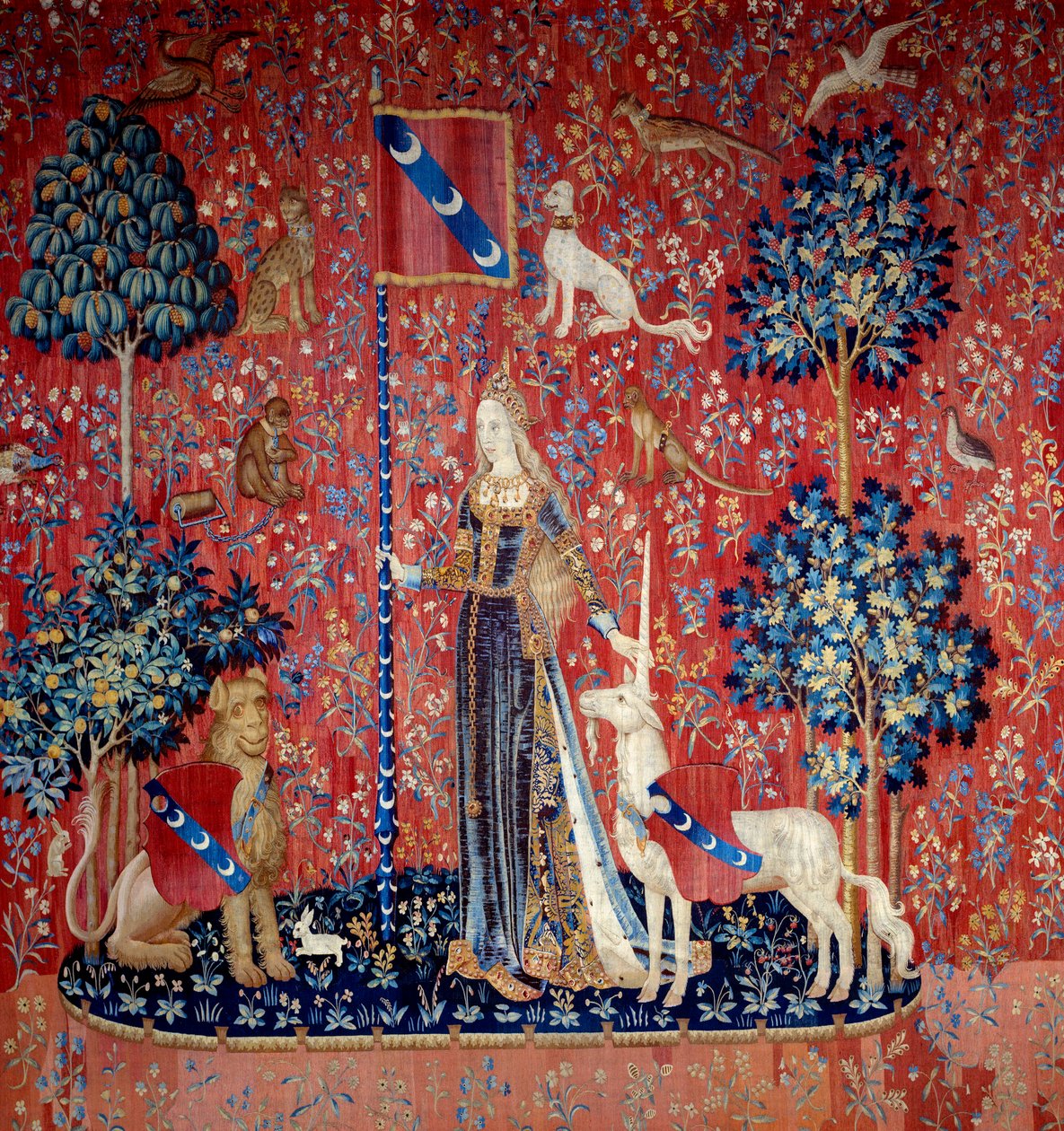 Uma jovem rodeada por um leão, um unicórnio, um macaco, coelhos) - Tapeçaria de lã e seda realizada entre 1484 e 1500, do castelo de Boussac, Creuse. Sol. 3,7x4,7 m - Paris, Museu Nacional da Idade Média, Termas de Cluny - Alegoria do tato (Le Touch de Flemish School