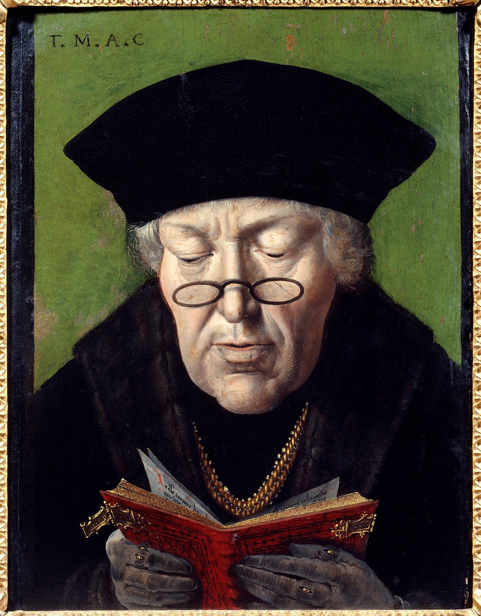 Retrato de Thomas More (1478-1535), humanista. O humanista é representado com óculos lendo um livro. Pintura da Escola Flamenga de Flemish School