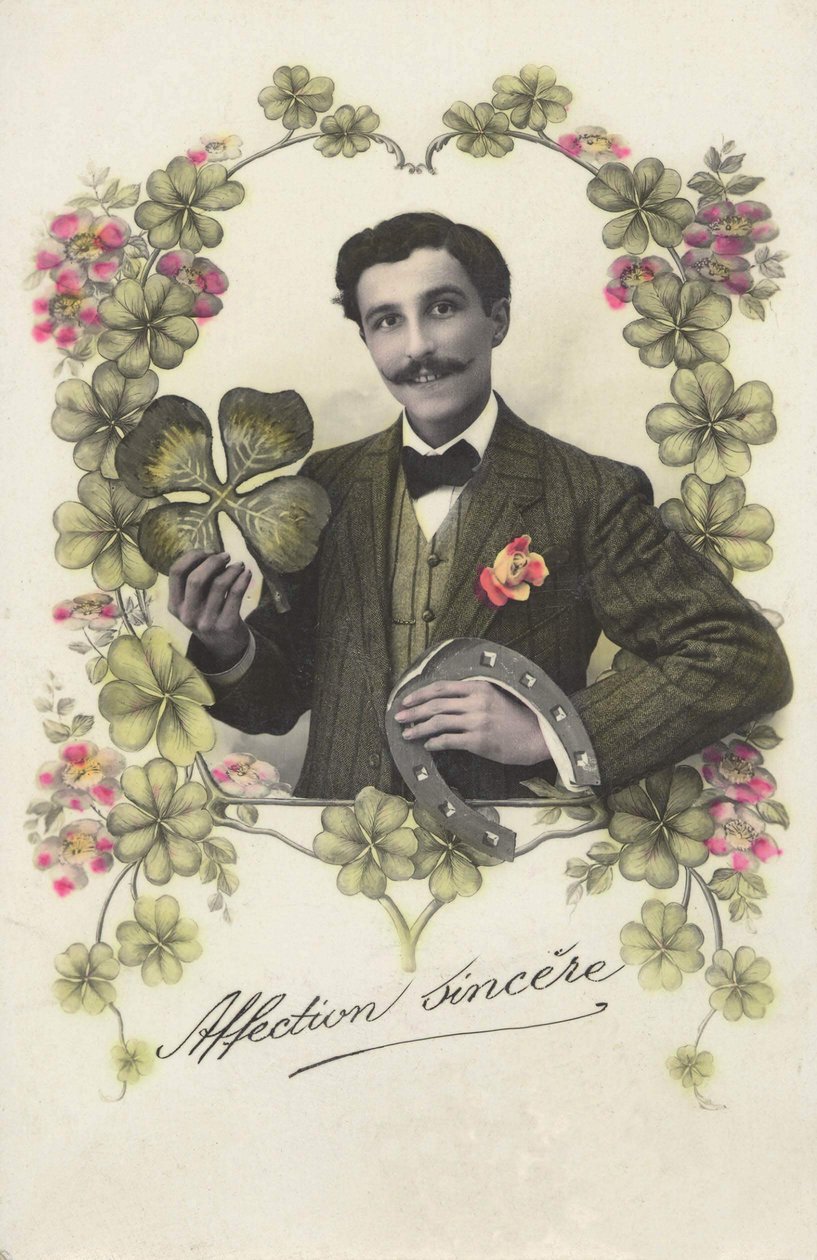 Um homem com um trefle de quatro folhas e uma ferradura. de French School