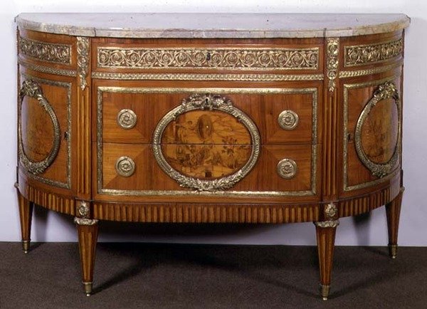 Commode, com painéis de marchetaria em tulipa, montados em ormolu, de Joseph Stockel de French School