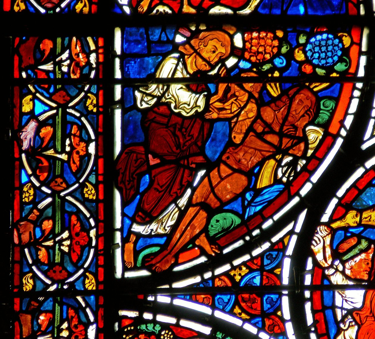 Detalhe de uma janela representando a parábola do Bom Samaritano: A criação de Eva de French School