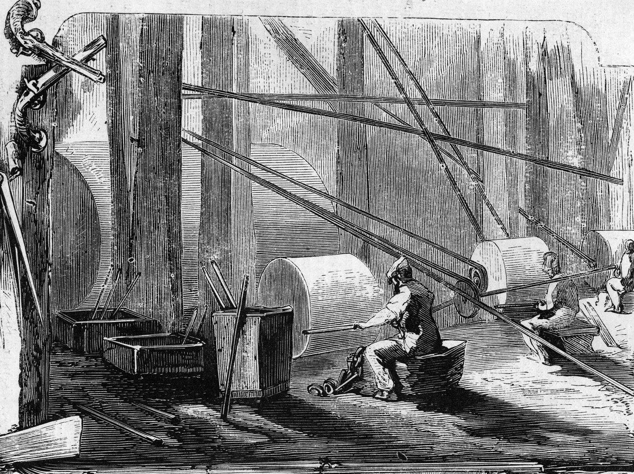 Fabricação de espingardas: polimento de cilindros de ferro com rodas de pedra. Gravação em "Le Monde Illustré" n°35 de 12 de Dezembro de 1857. de French School