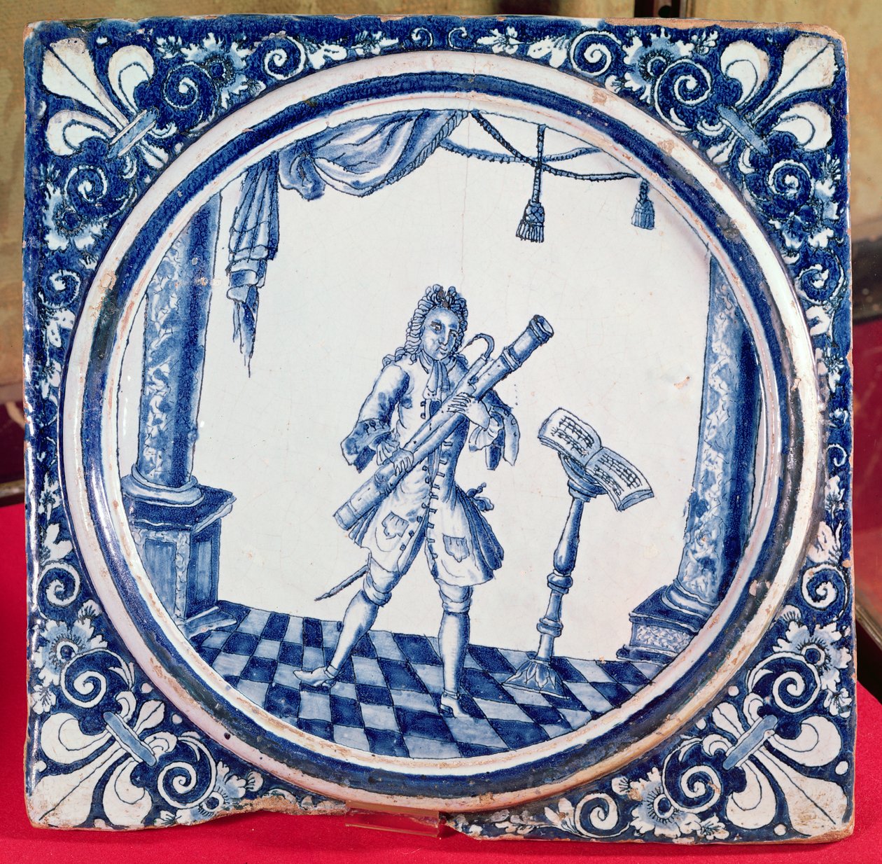 Azulejo representando um fagotista, 1706 (faiança) de French School