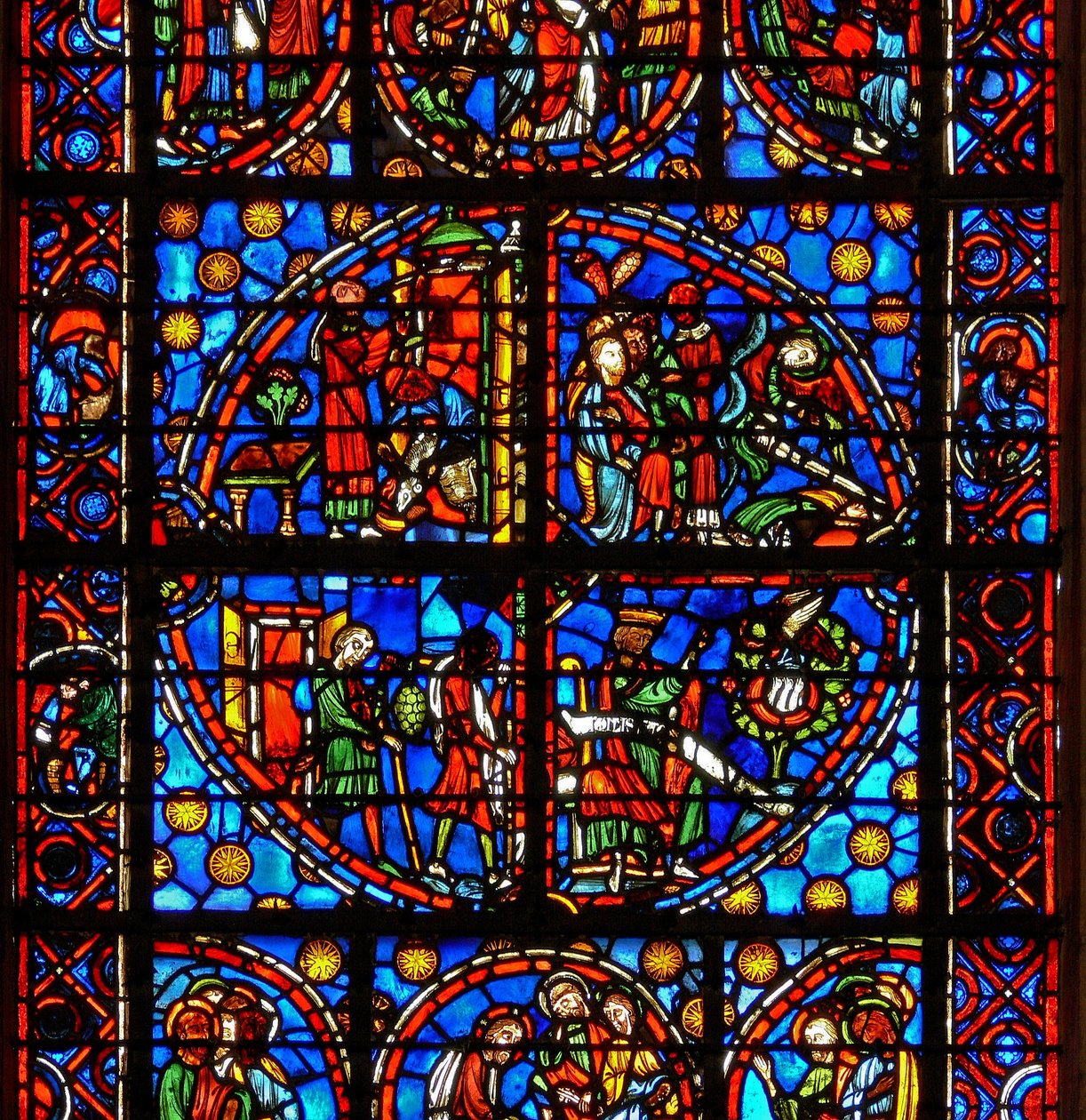 Janela w10 representando cenas tipológicas do Antigo Testamento: os Espiões e as uvas; David e o pelicano; duas cenas de Páscoa de French School