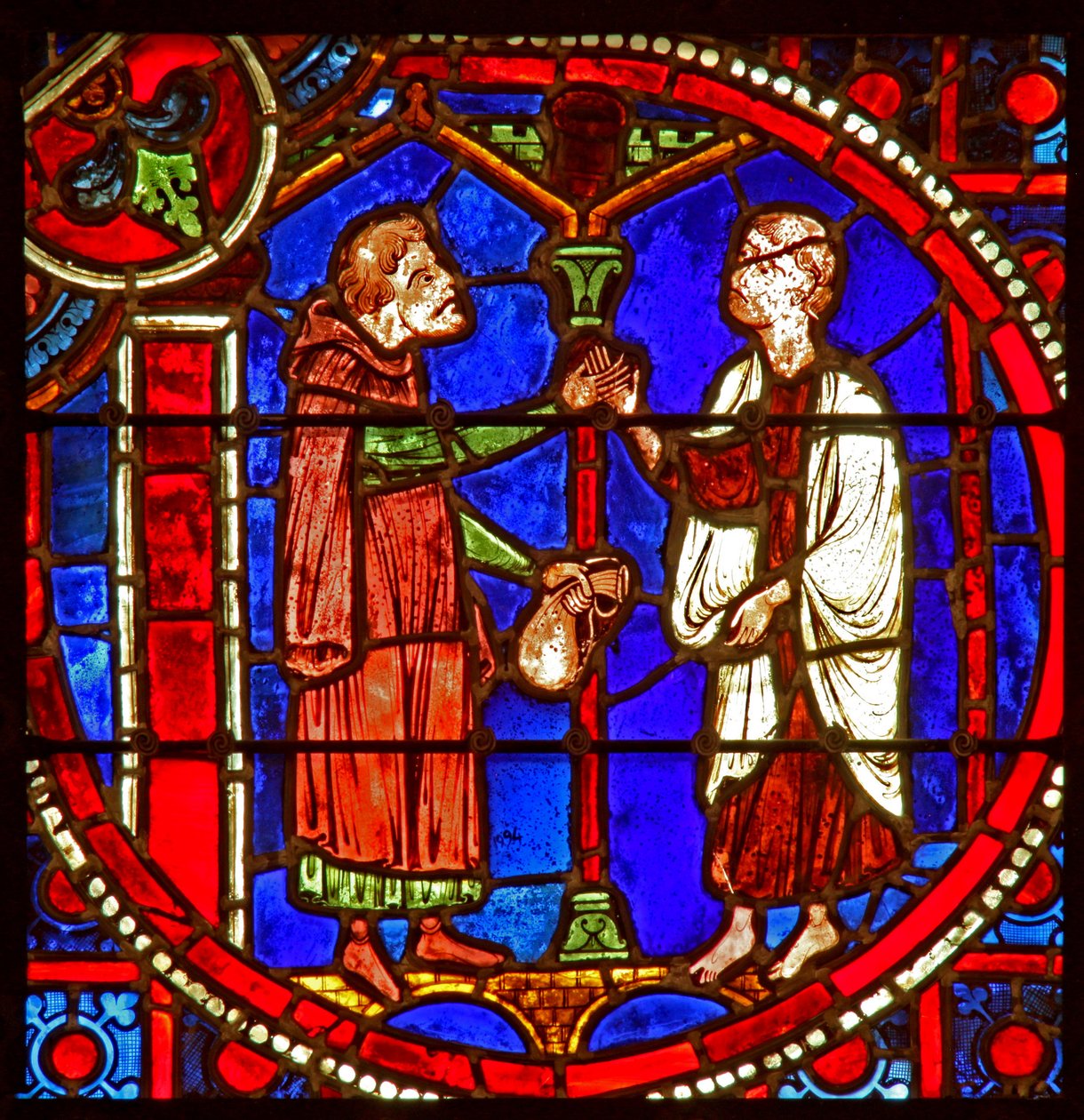 Janela w1 representando uma cena da história de Theophilus: ele solicita a ajuda de um mágico de French School