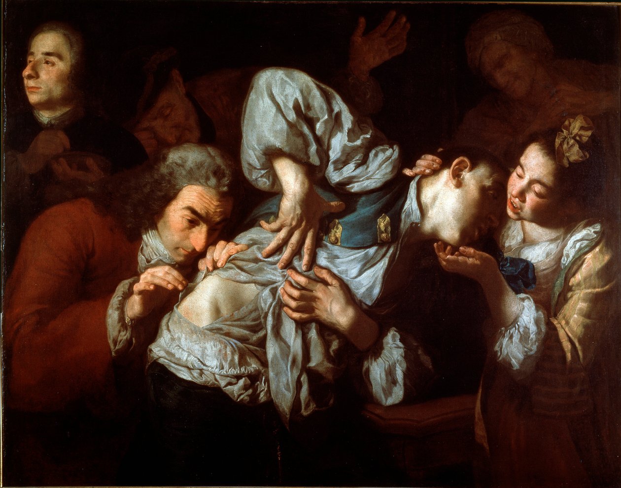 As feridas Um homem ferido é examinado por um médico e tranquilizado por uma jovem mulher. Pintura por Gaspare Traversi (ca. 1722-1770). 1752 aproximadamente. Sol. 100x127 cm Galleria dell