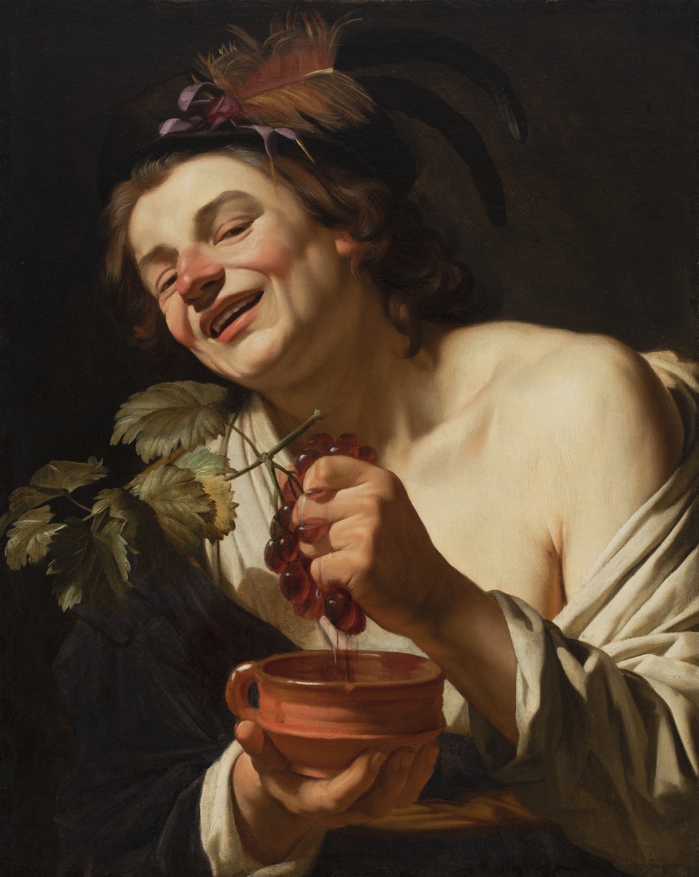 Sorrindo jovem espremendo uvas, 1622 de Gerrit van Honthorst