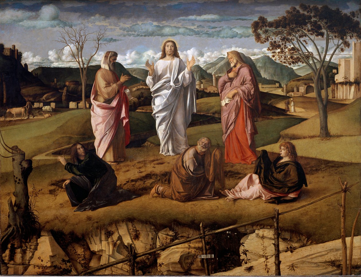 A transfiguração de Cristo. Os personagens do Antigo Testamento Moisés e Elias são representados ao redor de Jesus. A assinatura do artista é representada em um papel segurando o fechamento em primeiro plano. Pintura de Giovanni Bellini disse il Giambellin de Giovanni Bellini