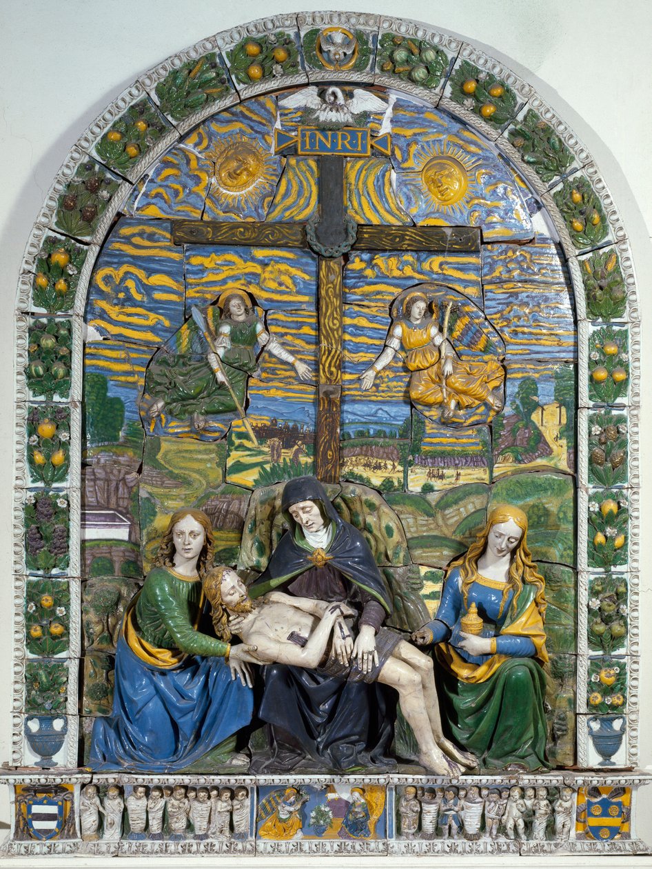 A Deposição (Pieta) Jesus Cristo e a Virgem Maria rodeada por São João e Santa Maria Madalena diante da cruz com a inscrição INRI (I.N.R.I.). Cerâmica em baixo relevo de Giovanni della Robbia (1469-1529) Dim. 3x2,28 m Florença, Museo Nazionale de Giovanni della Robbia