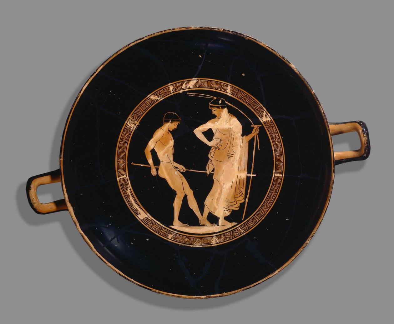 Copa ateniense de figuras vermelhas; representação do menino atleta e treinador, 480 aC (cerâmica) de Greek