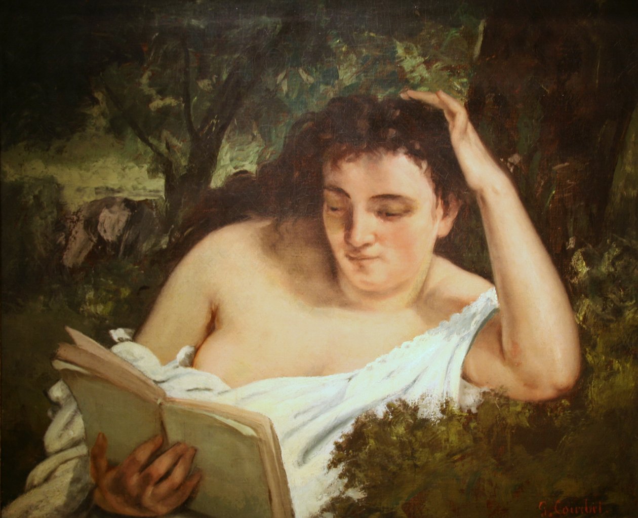 Uma jovem mulher lendo de Gustave Courbet
