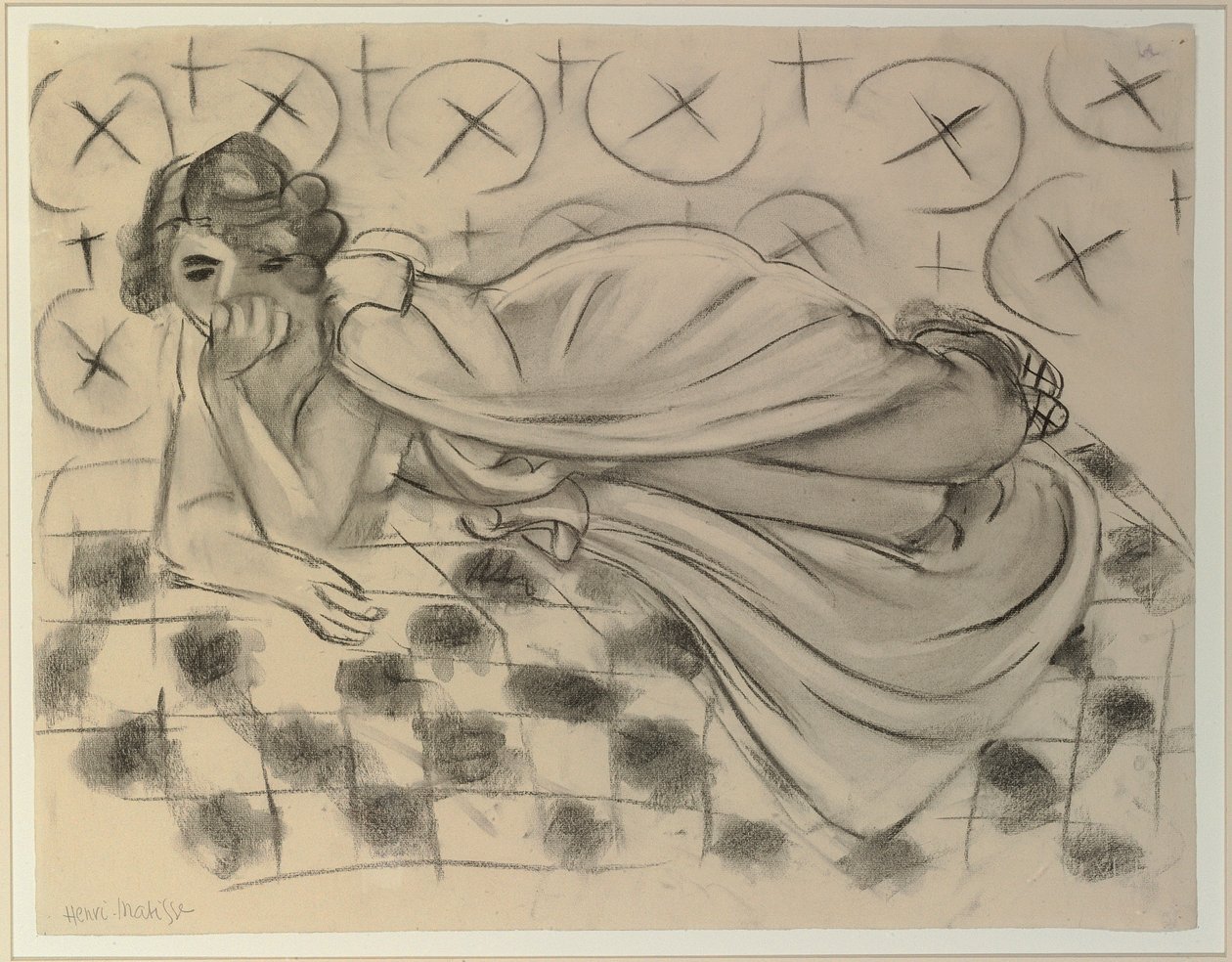 Figura drapeada deitada num sofá preto axadrezado de Henri Matisse