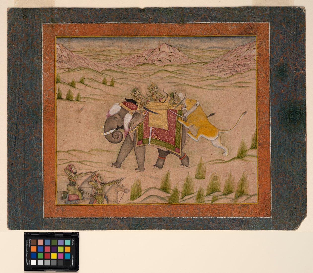 Um leão ataca um grupo de caça em cima de um elefante, c.1810 (aquarela opaca e ouro no papel) de Indian School