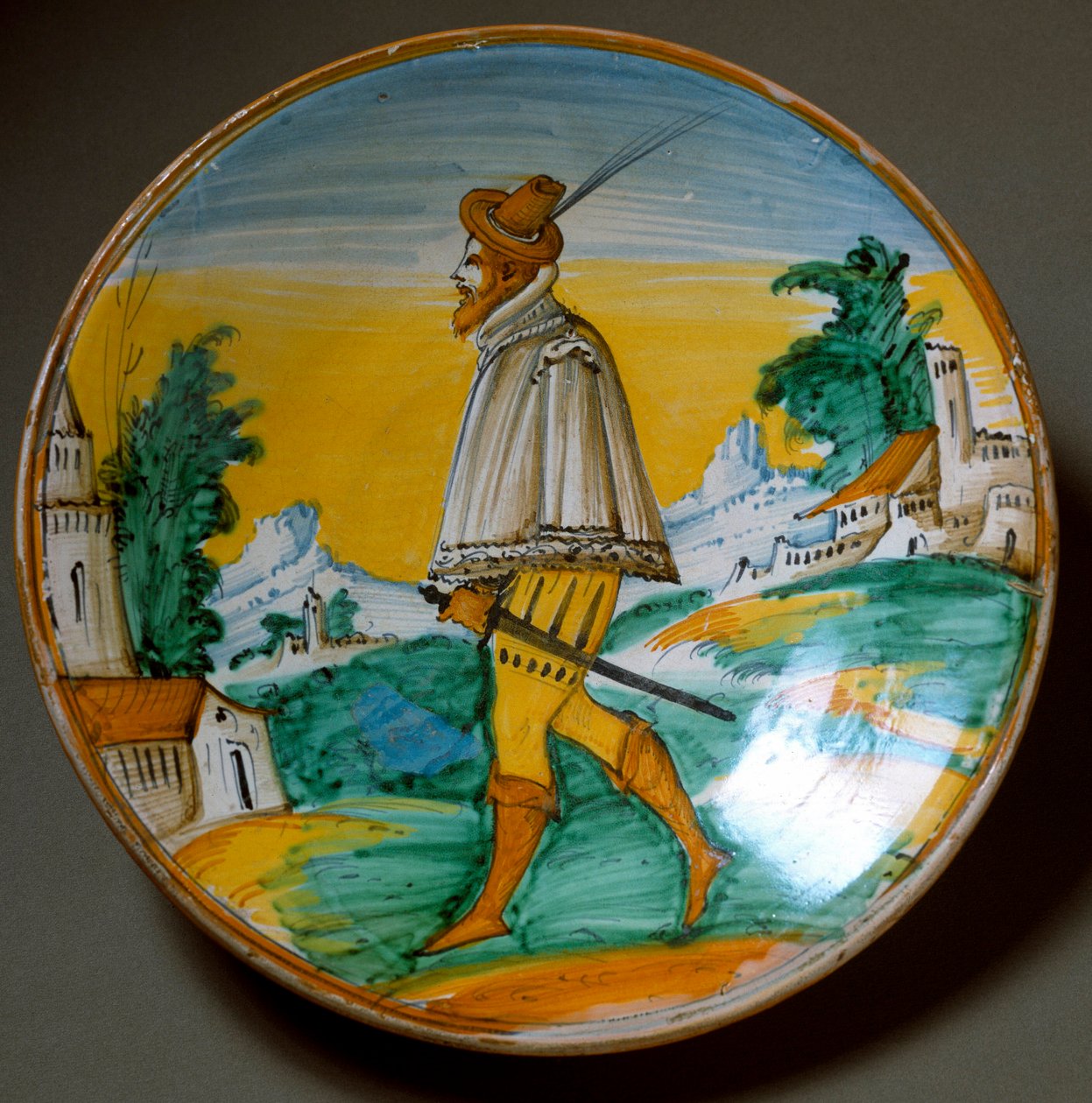 Jovem pistoleiro. Placa de cerâmica produzida em Viterbo, Itália. Fim do século XVI Florença, Museo Nazionale del Bargello de Italian School