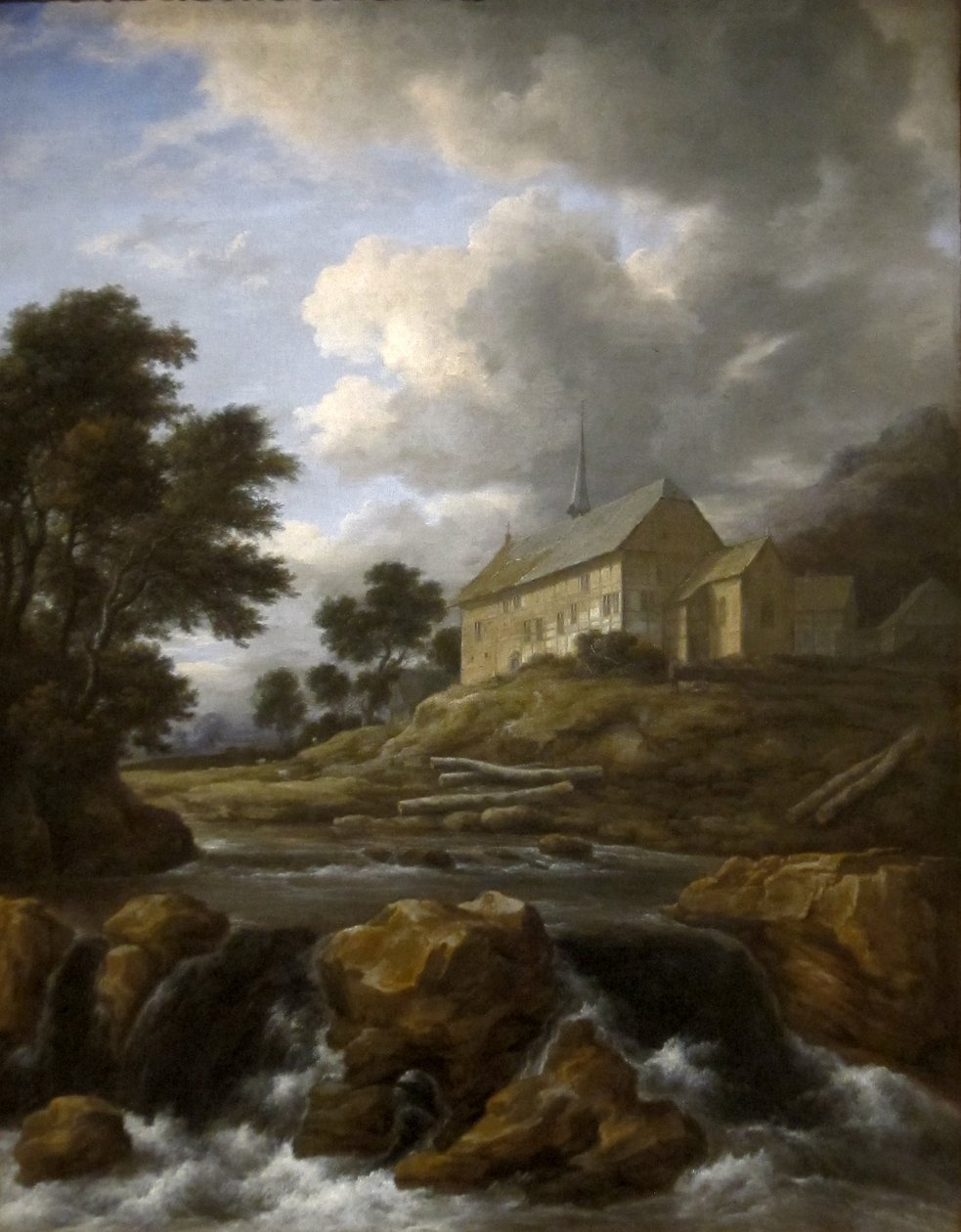 Paisagem com uma igreja junto a uma torrente de Jacob van Ruisdael
