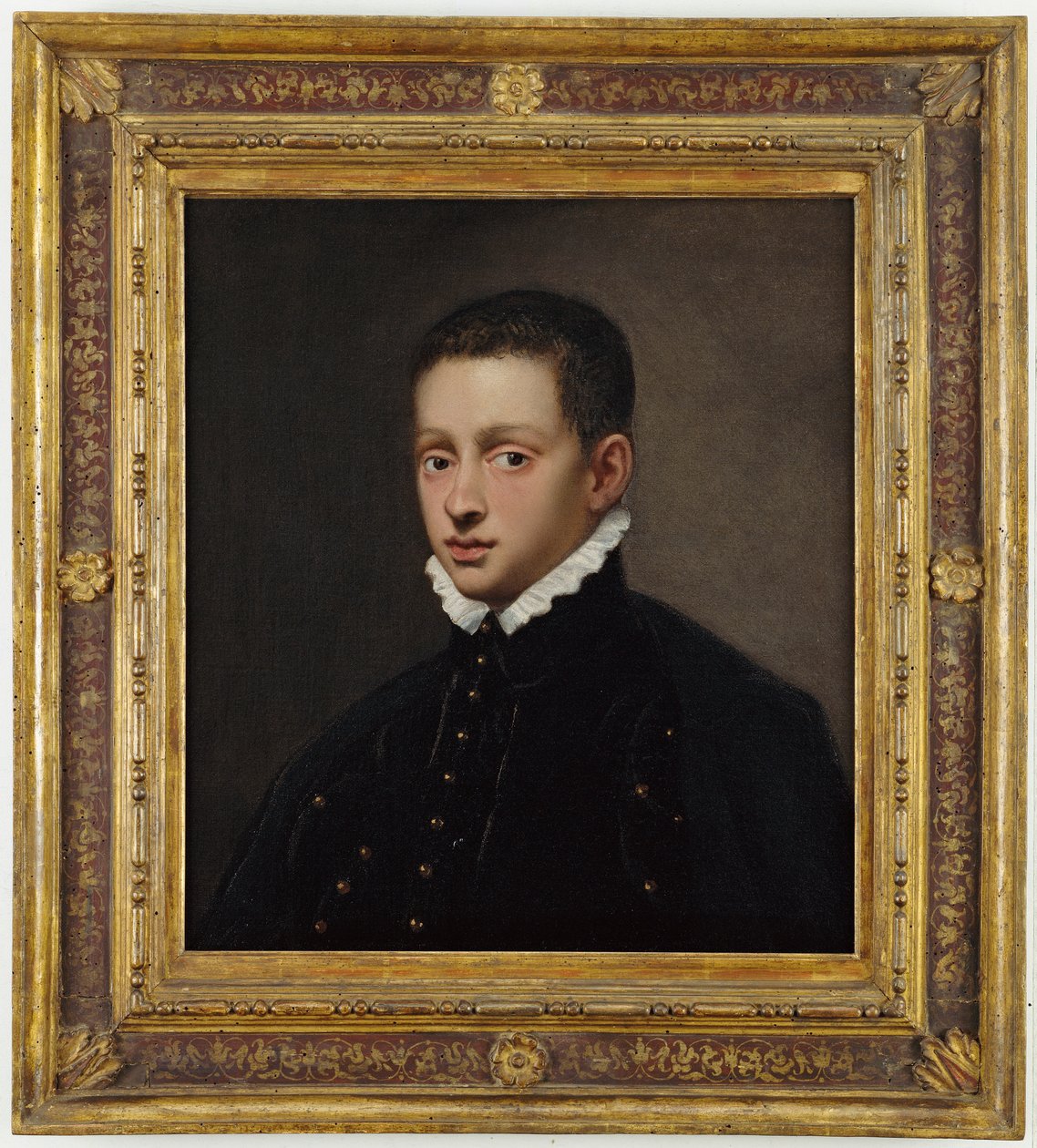 Retrato de menino, na altura do busto, com gibão preto e colarinho branco de Jacopo Robusti Tintoretto