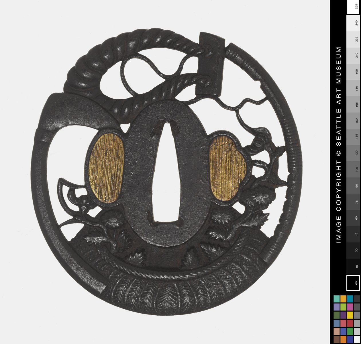Tsuba: Flores, Scythe, Rope, início do 18º aniversário.
século (Ferro) de Japanese School