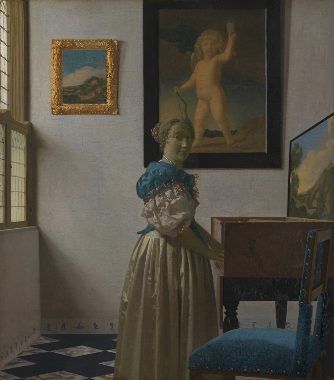 Eine junge Frau an einem Virginal de Johannes Vermeer