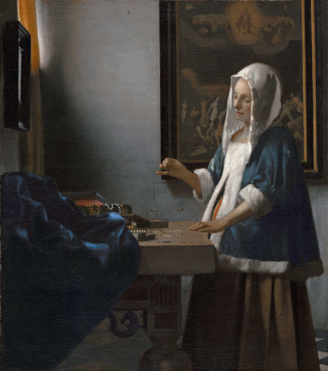 Mulher a segurar uma balança de Johannes Vermeer