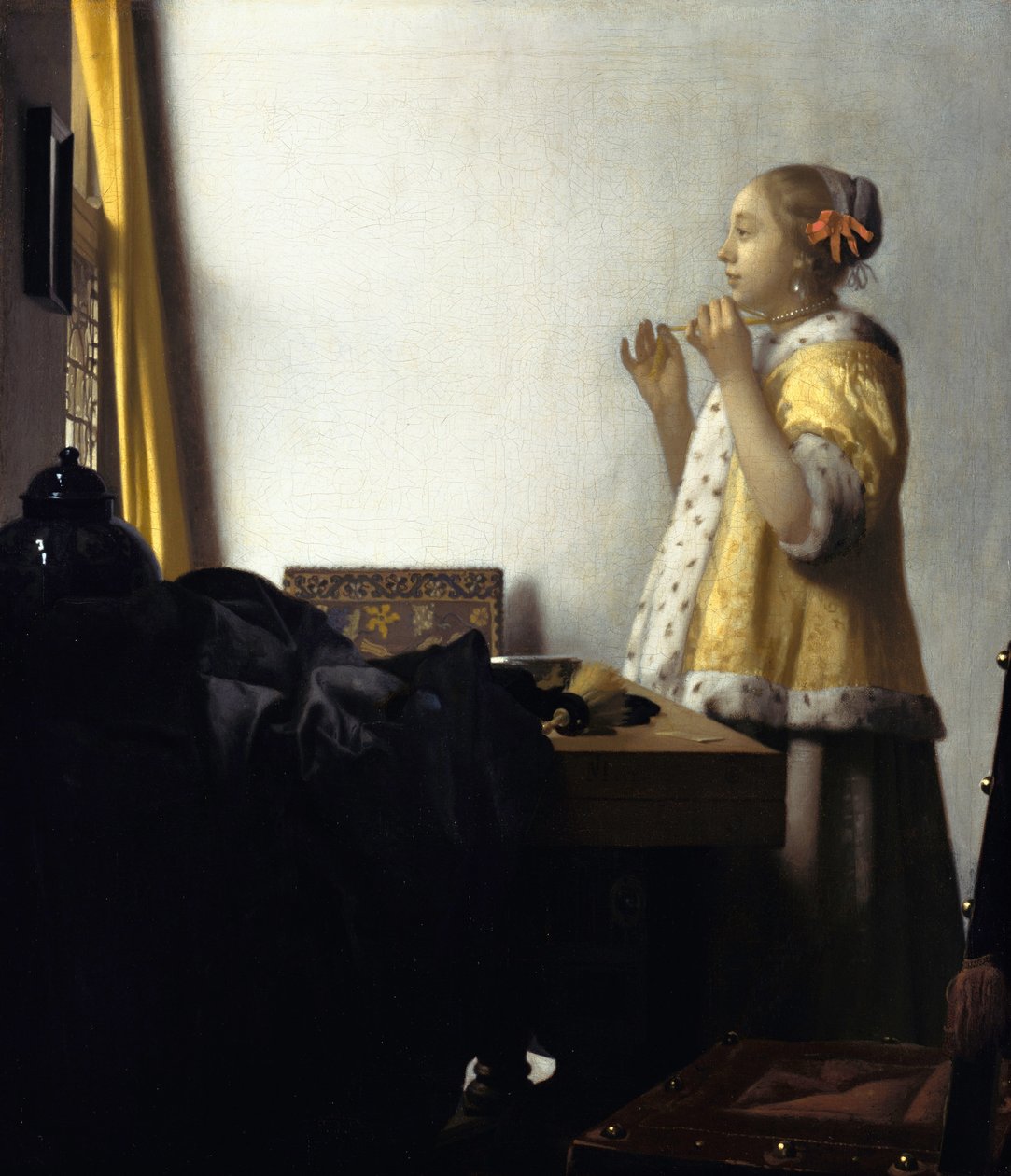 Mulher jovem com um colar de pérolas de Johannes Vermeer