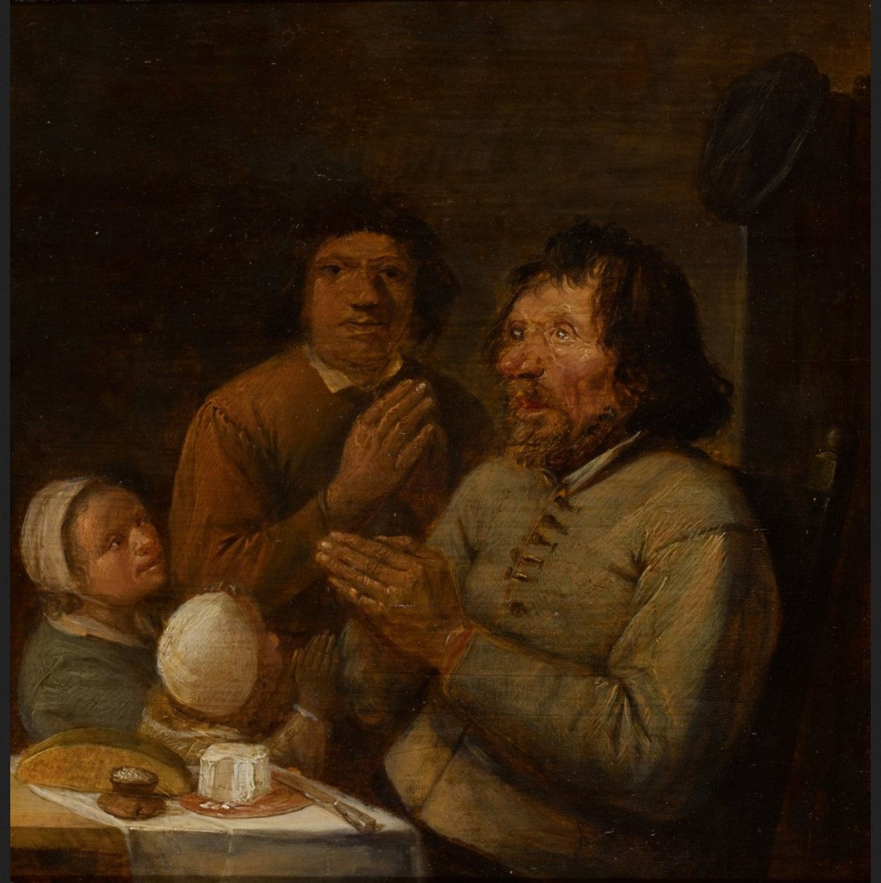 Interior com uma família de camponeses a rezar de Joos van Craesbeeck