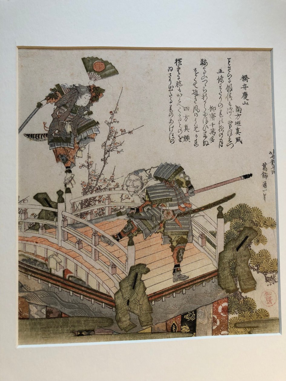 A cena da ponte de Gojō com Benkei e Yoshitsune num carro alegórico de Katsushika Hokusai