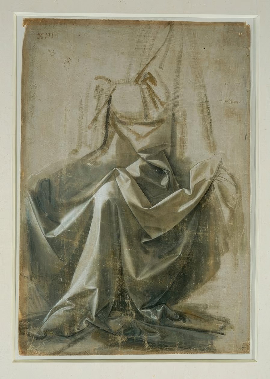 Vestes estudam uma figura sentada de Leonardo da Vinci