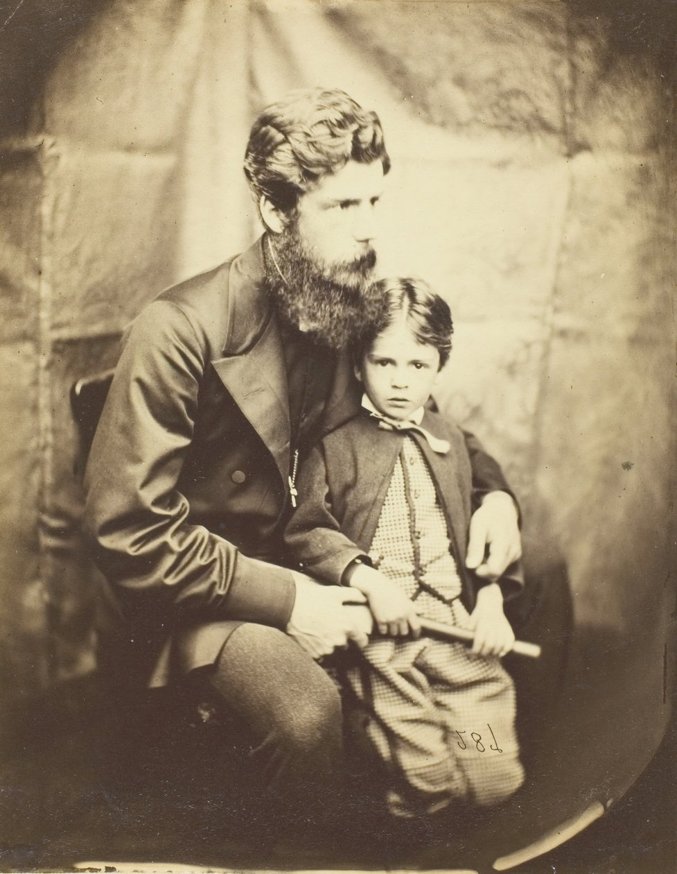 Rev. James Langton Clark e o filho Charles Robin, 1864. de Lewis Carroll