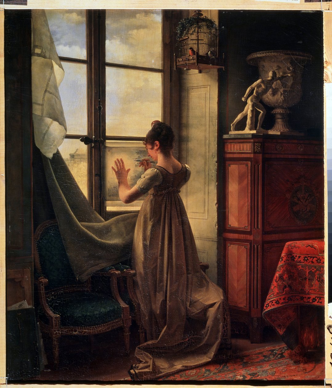 ""A Filha do Artista Copiando um Desenho"" (A Filha do Artista copiando um Desenho) A jovem é representada por trás, decotada no pescoço, copiando um desenho, encostada na vidraça da janela. Pintura de Martin Drolling (1752-1817) 1812 Muse de Martin Drölling