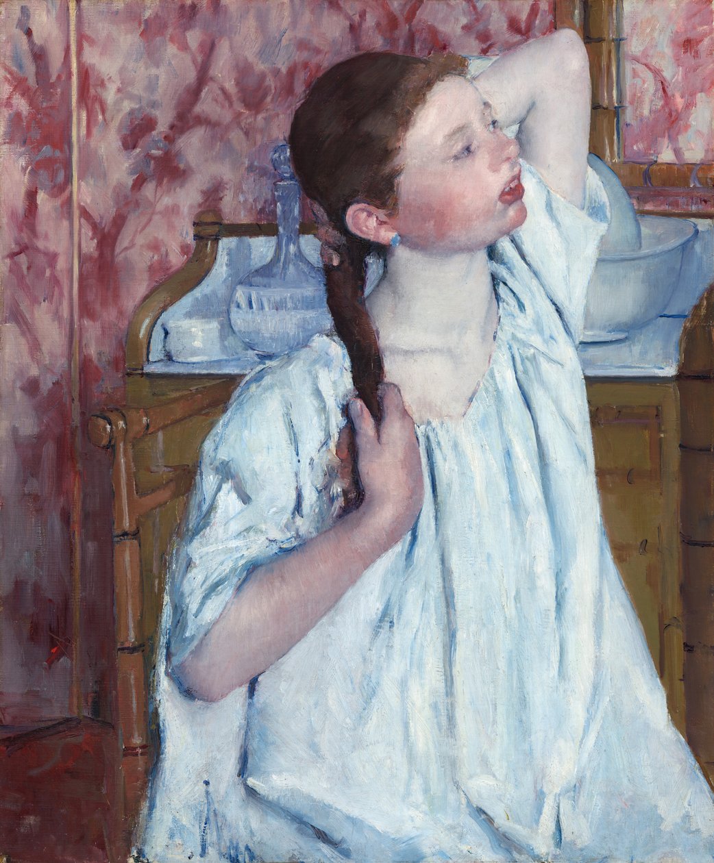 Girl Arranging Her Hair, 1886. de Mary Cassatt