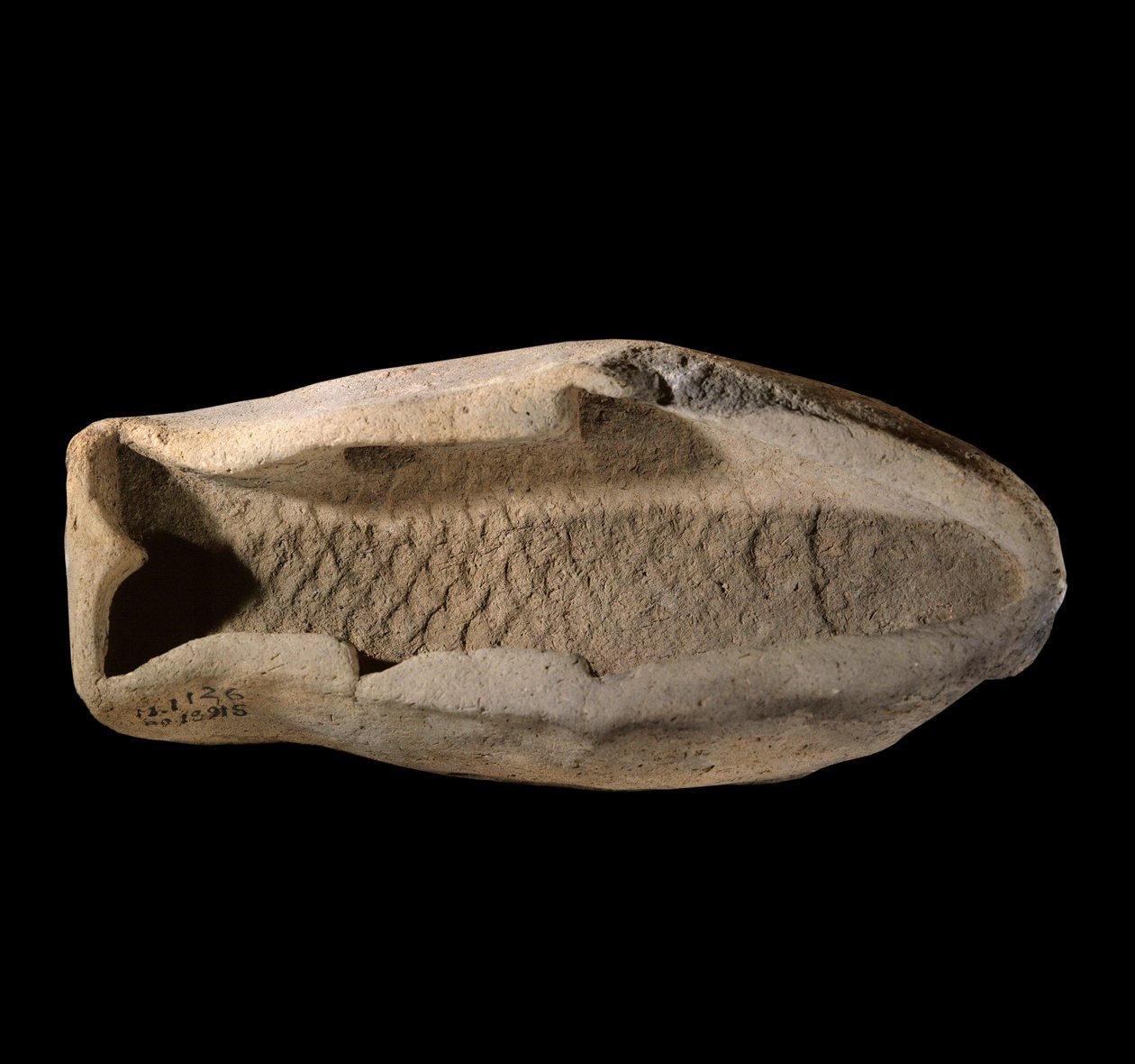 Mesopotâmia: molde de terracota em forma de peixe. Por volta de 1800 AC. Dos pratos reais do Palácio do Rei Zimrilim a Mari. Paris, Museu do Louvre de Mesopotamian