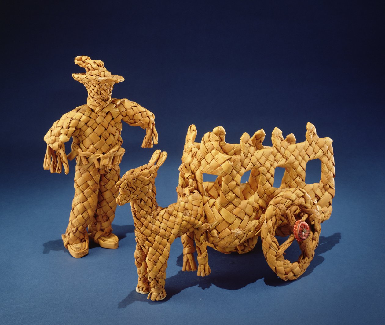 Homem de brinquedo e carroça, de Jalisco (cascas de milho trançadas) de Mexican School